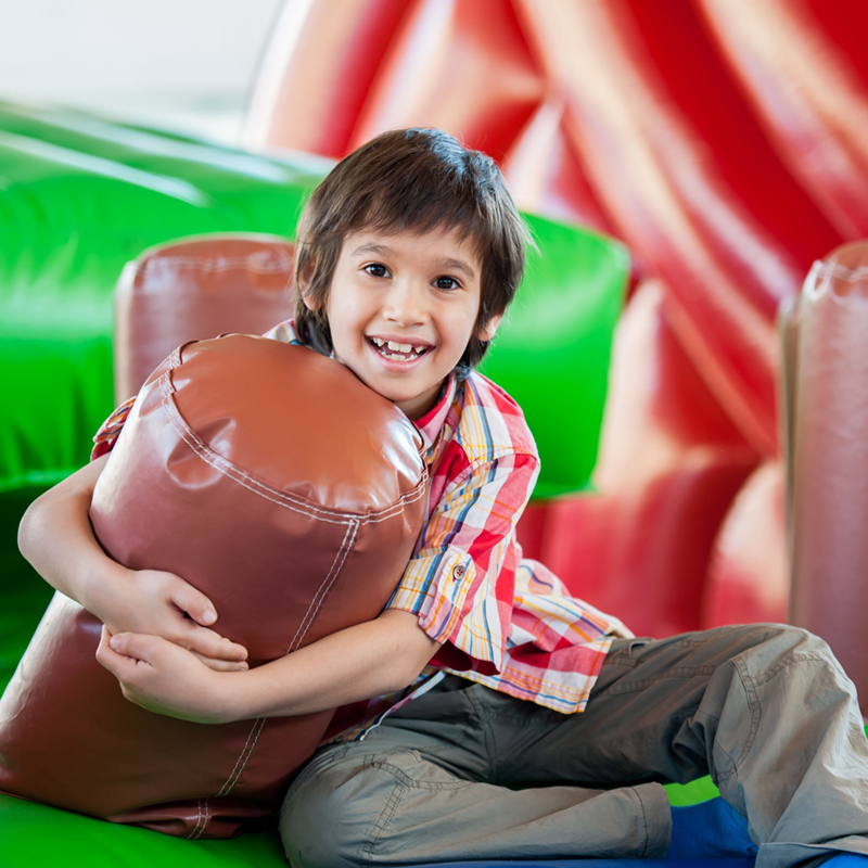 Child playing in bounce house